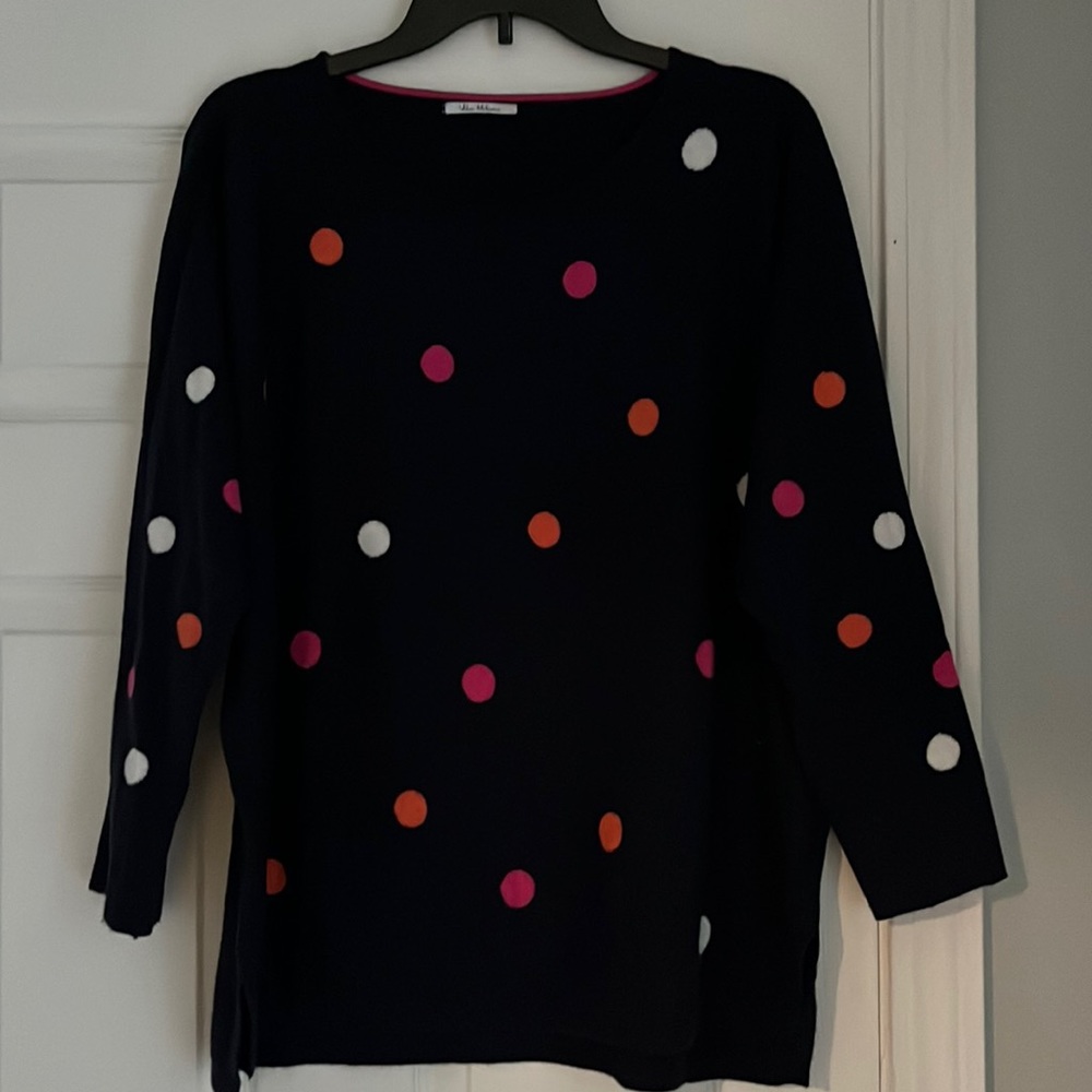 Fun polkadotted sweater on navy background